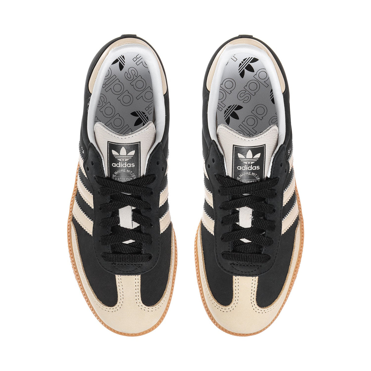 Adidas Samba OG women's shoe view: black laces, cream lining, and adidas logo on tongue.