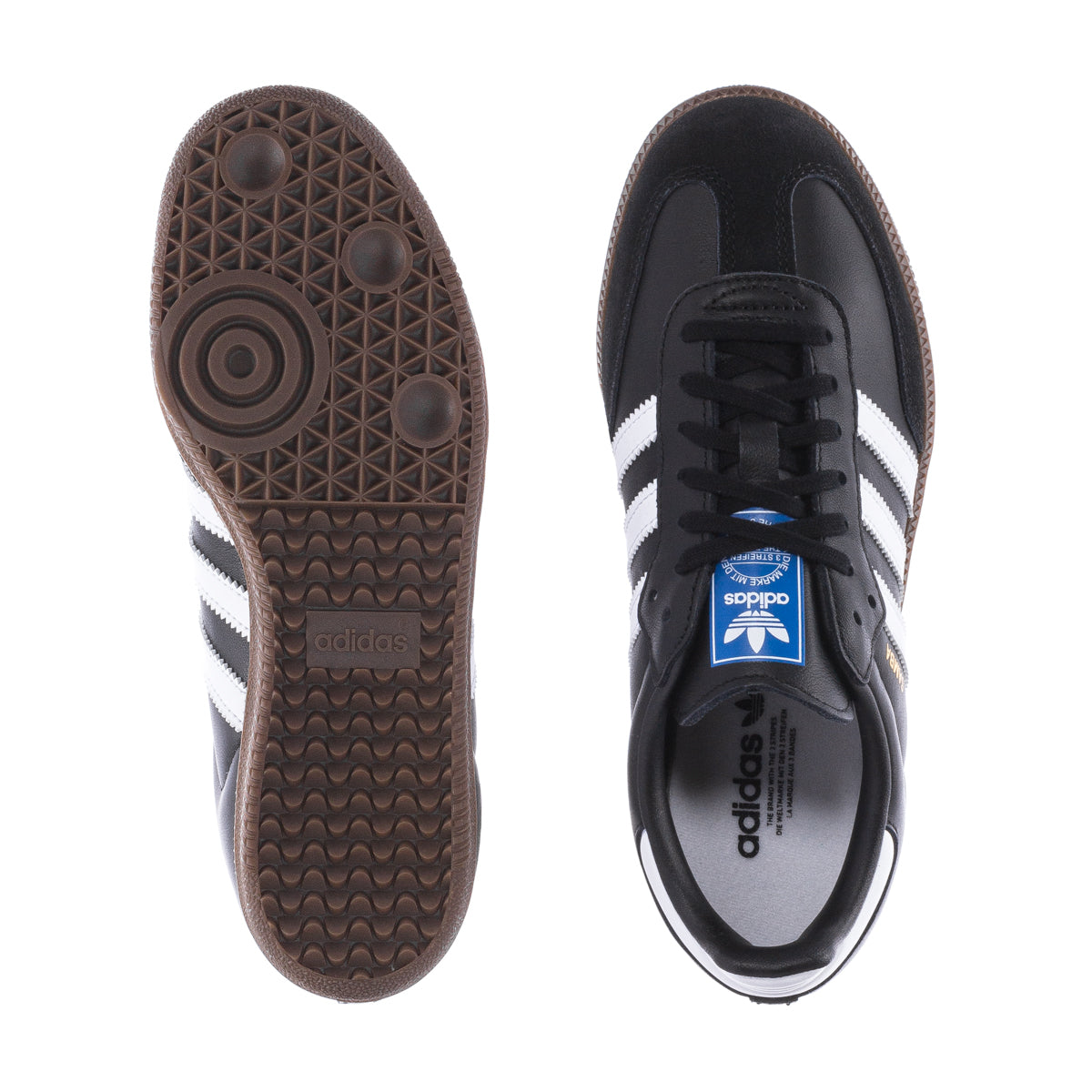 Adidas kids' Samba OG shoes showing outsole tread and black lace-up upper.