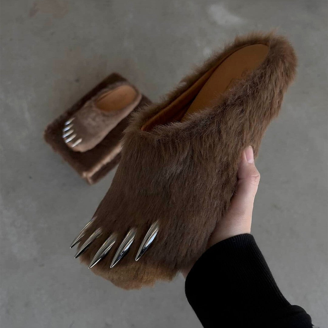 Brown faux-fur bear claw mules with metal spikes, worn slip-on style