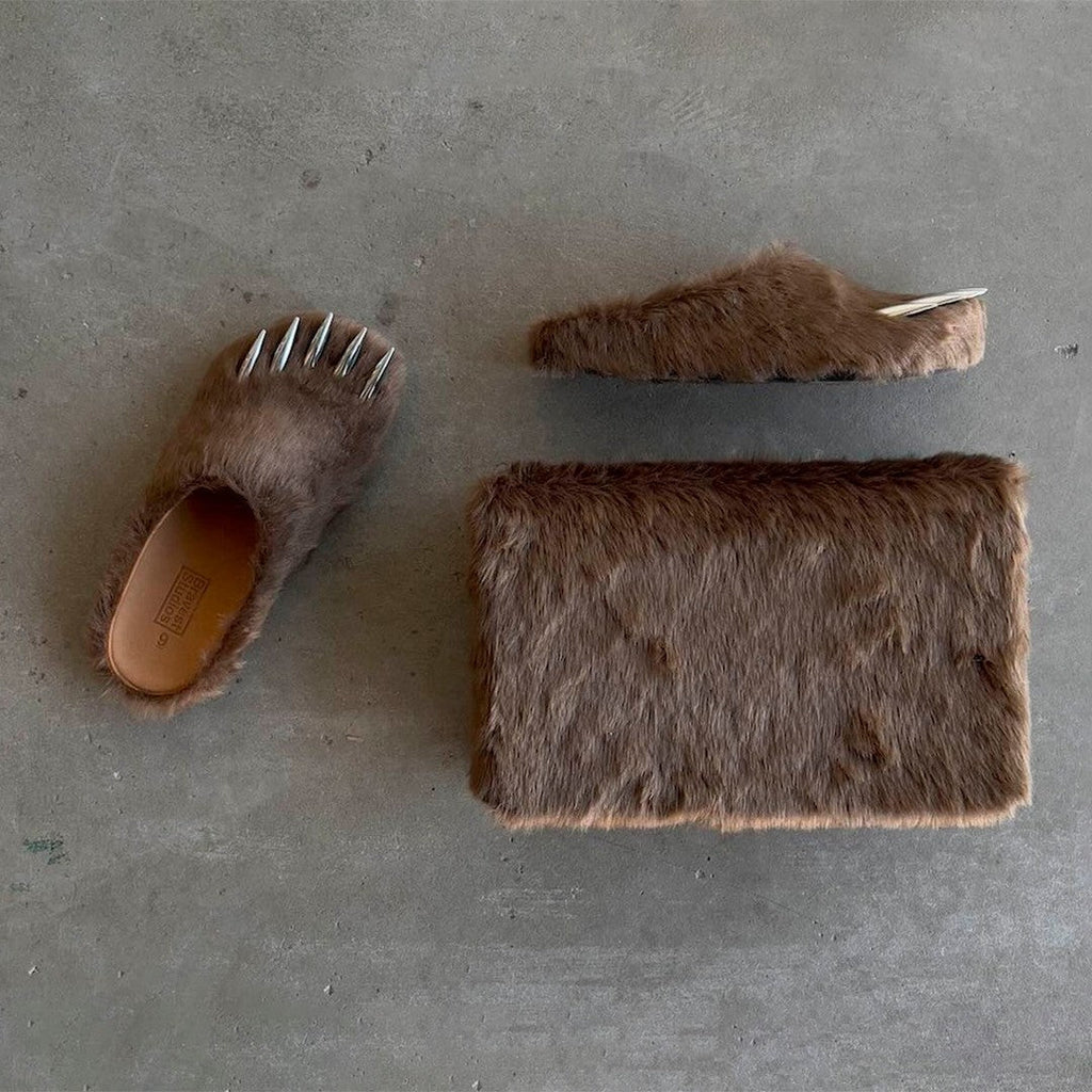 Brown bear claw mules with metal spikes, flat-lay with open instep