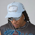 Light blue men's baseball cap with embroidered fish logo and star details
