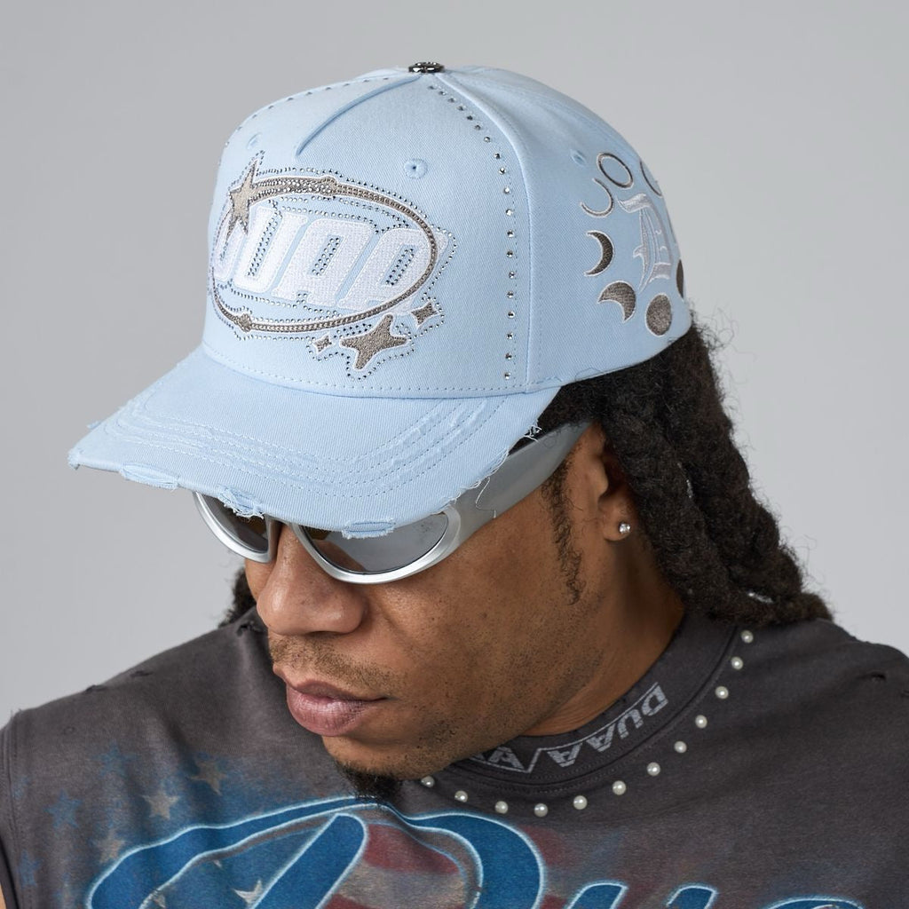 Light blue men's baseball cap with stitched fish logo and curved side graphics