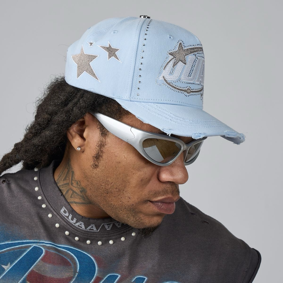 Light blue men's baseball cap with star appliques and fish logo patch on front