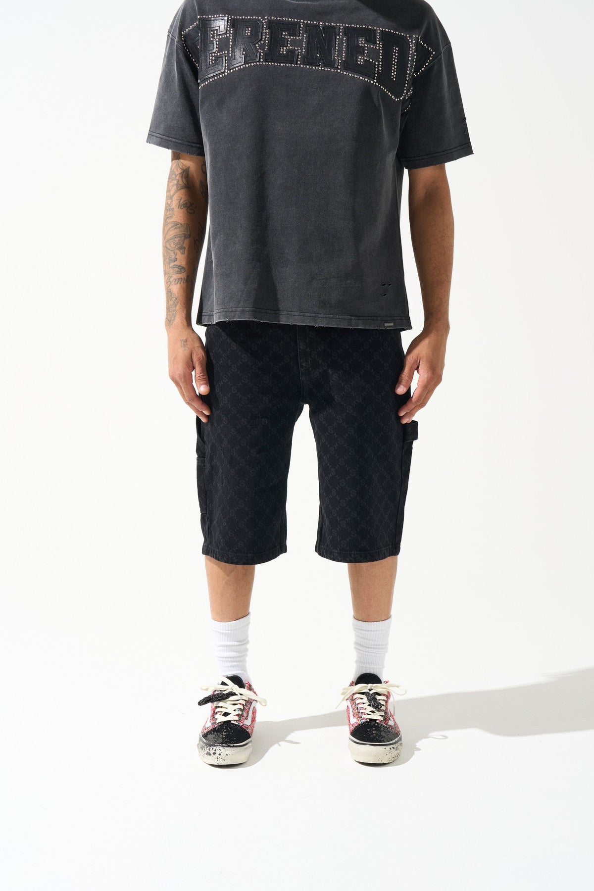 Men's black denim shorts with monogram pattern, cargo-style pocket details