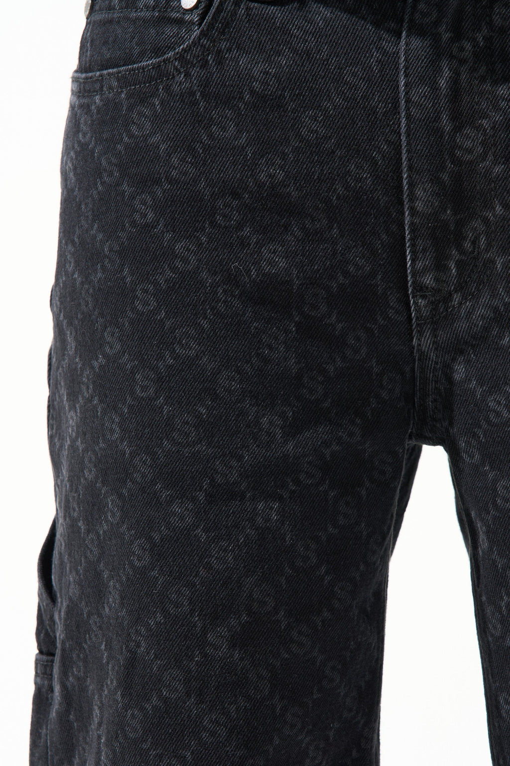 Black denim shorts front view with monogram-like denim texture and center seams
