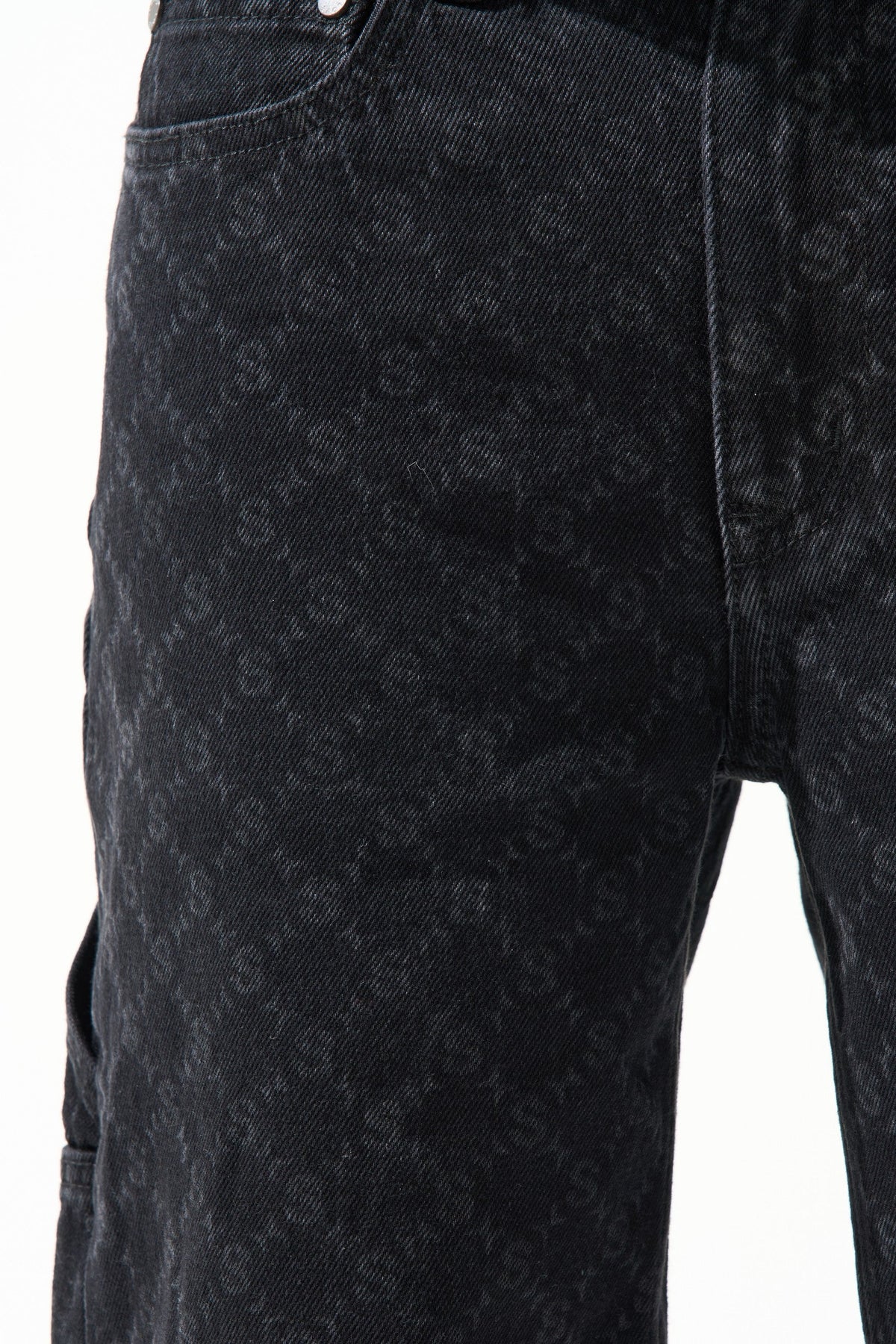Black denim shorts front view with monogram-like denim texture and center seams