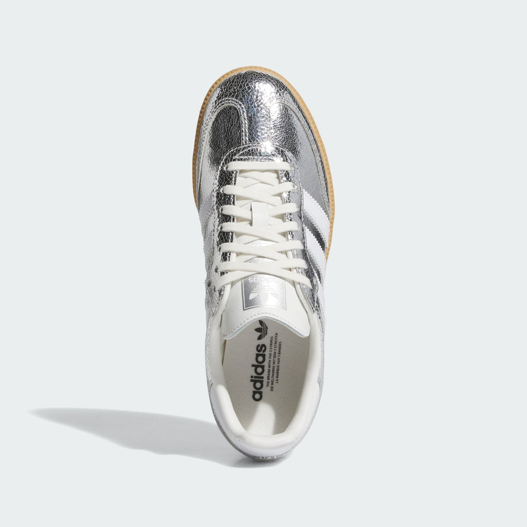 Kids' Samba OG J sneakers toe and lace view; silver metallic upper, white tongue.