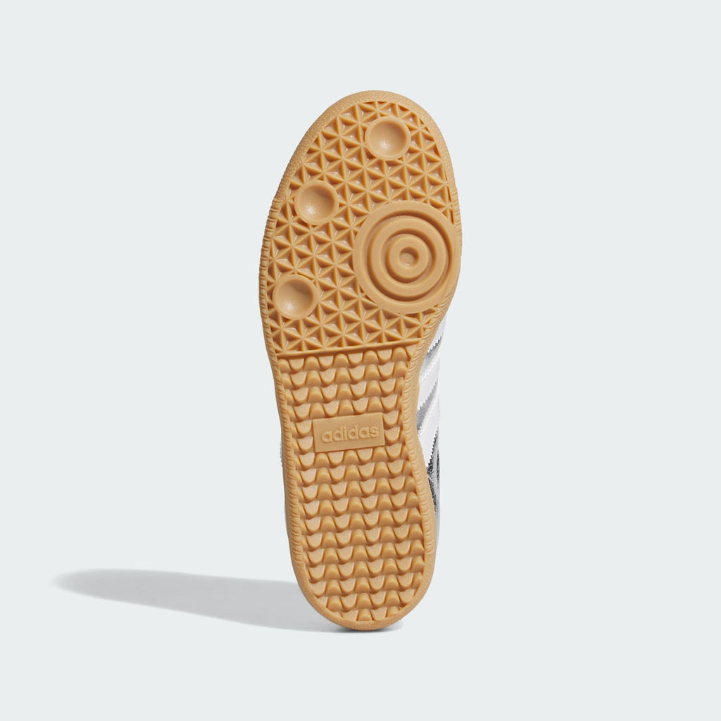 Kids' Samba OG J sneakers outsole view with gum rubber tread and adidas logo.