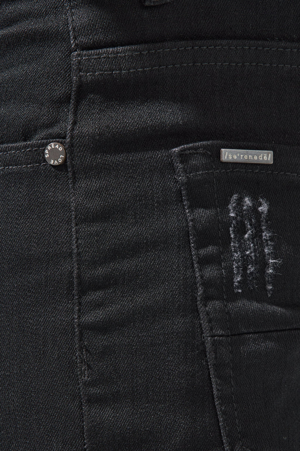 Jet black jeans front with button fly, belt loops, and logo label