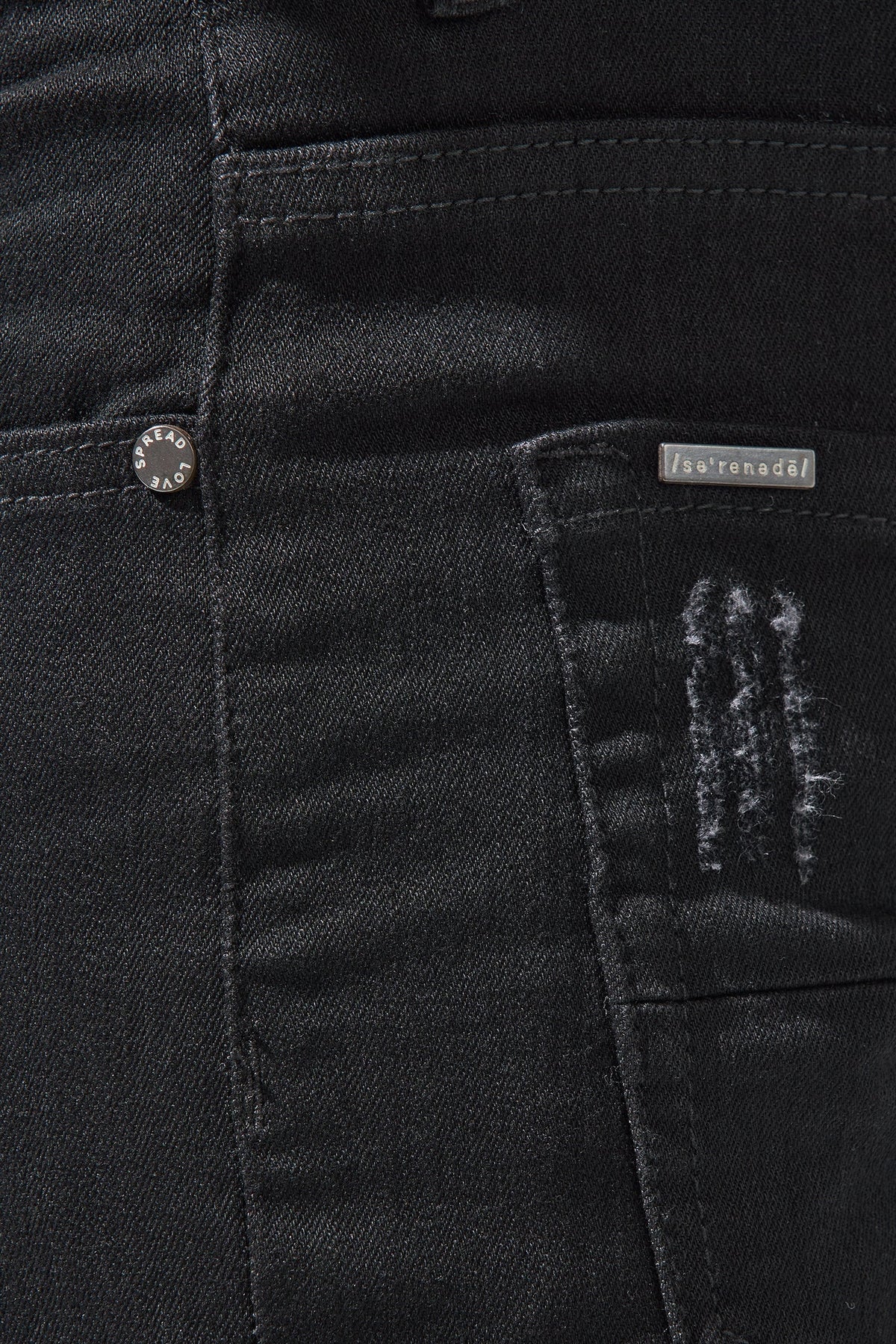 Jet black jeans front with button fly, belt loops, and logo label