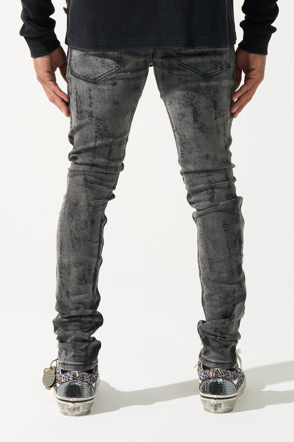 Men's charcoal washed jeans, back view with two patch pockets, slim tapered fit.