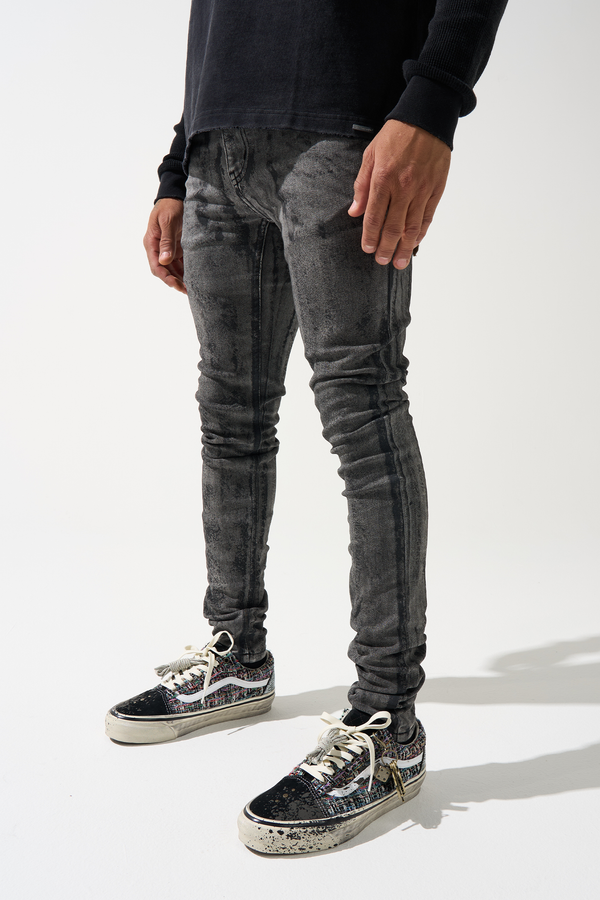 Men's charcoal washed jeans, distressed texture, slim tapered fit.