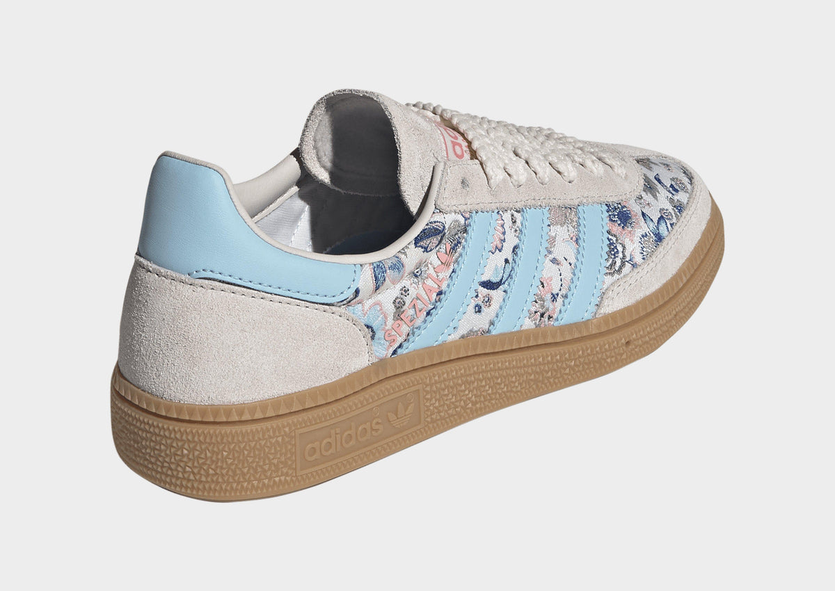 Kids' adidas Spezial sneakers with off-white suede, blue heel trim, and gum outsole