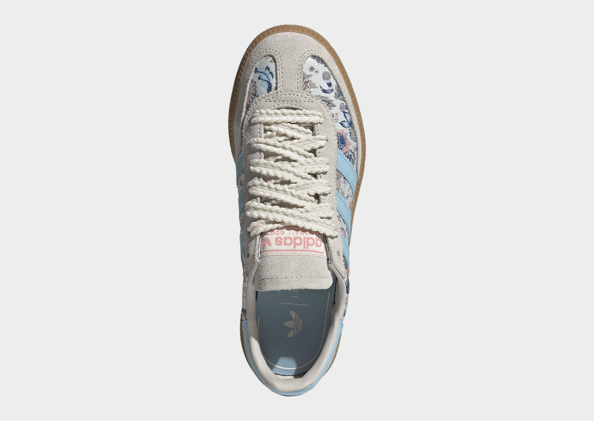 Kids' adidas Spezial sneakers toe view with off-white laces and blue floral details