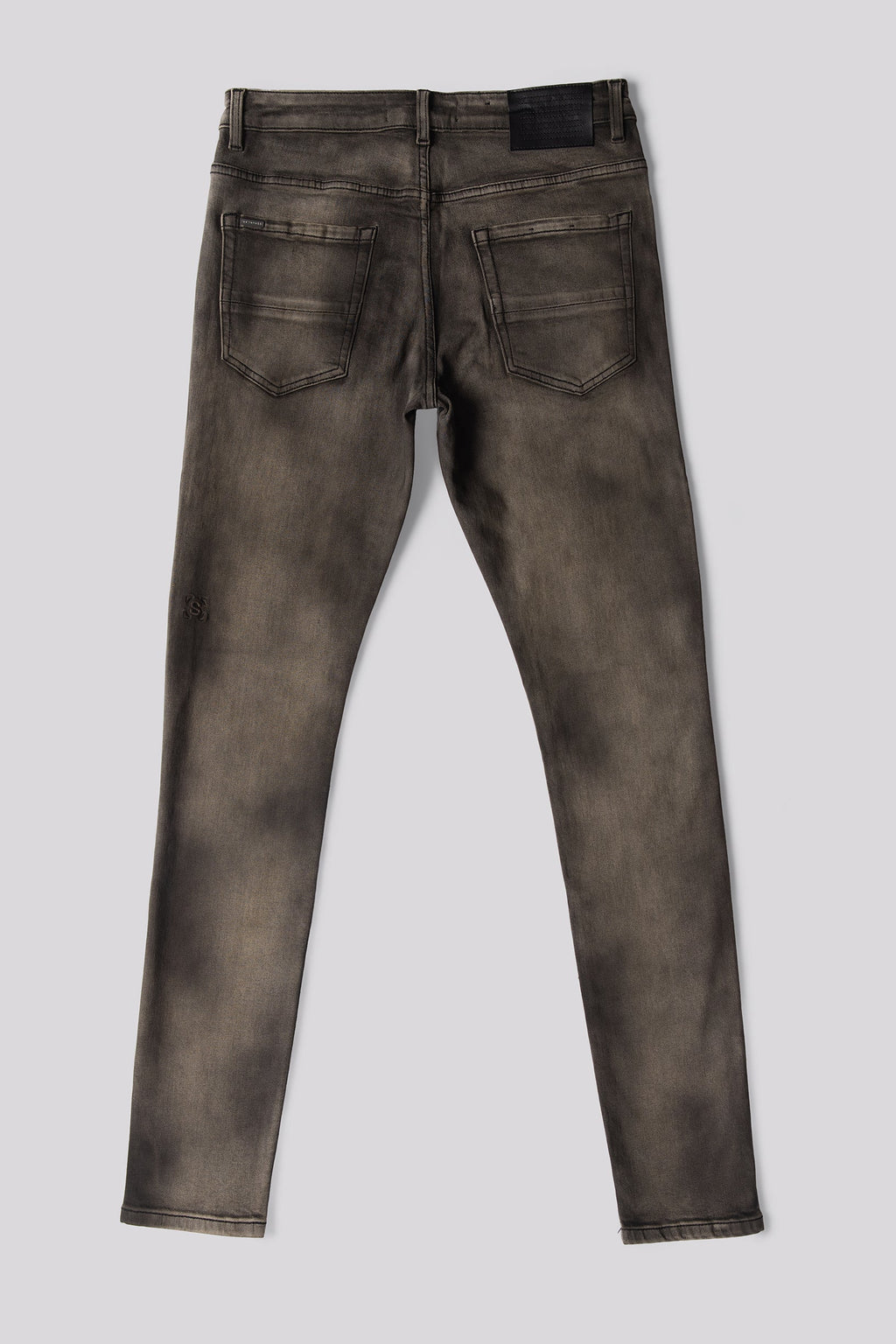 Men's olive-wash denim jeans, back view with yoke stitching and pockets.