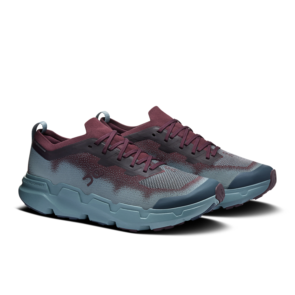 Men's lace-up running shoes with maroon tongue, speckled blue upper, and chunky light-blue sole