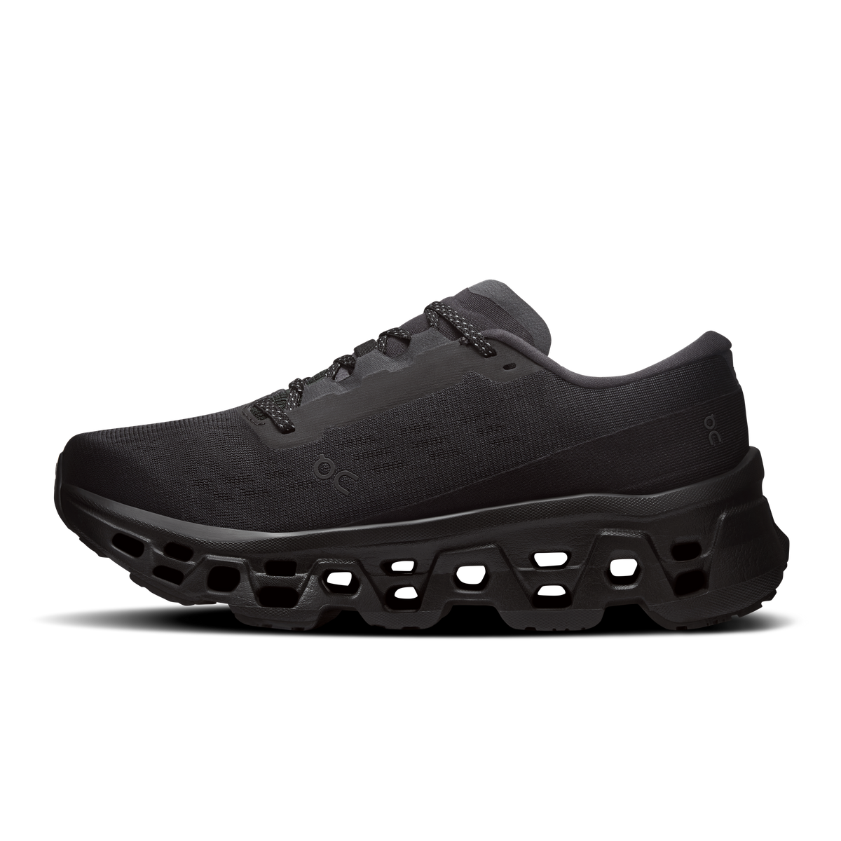 Women's black running shoes, angled side view, cushioned outsole and lace-up upper