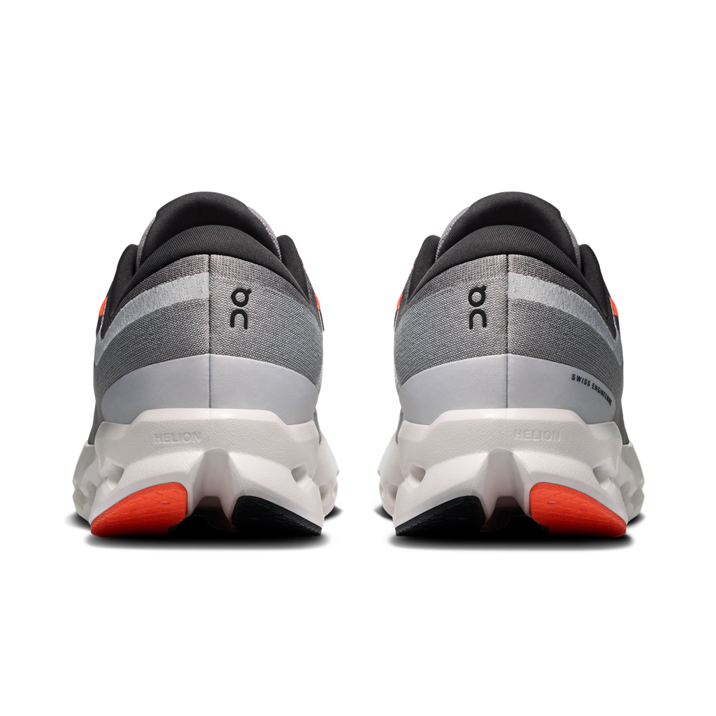 Men's running shoes heel view: gray fabric, white heel wedge, orange pods.