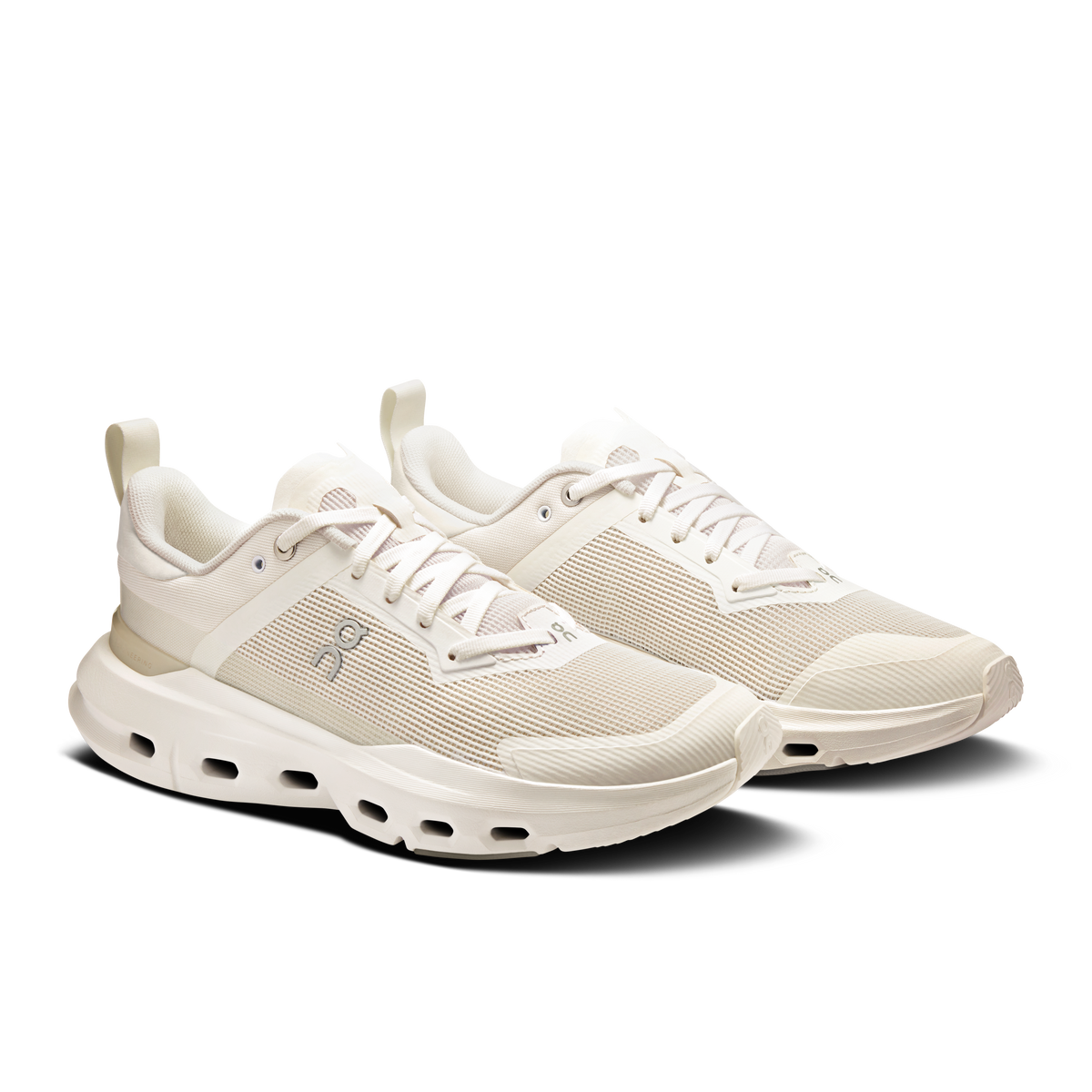 Women’s white lace-up running sneakers with textured upper and chunky CloudTec sole