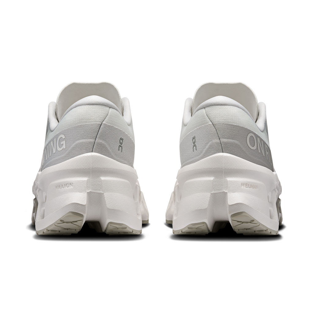 Women's white running shoes rear view with heel cushioning and lace-up collar