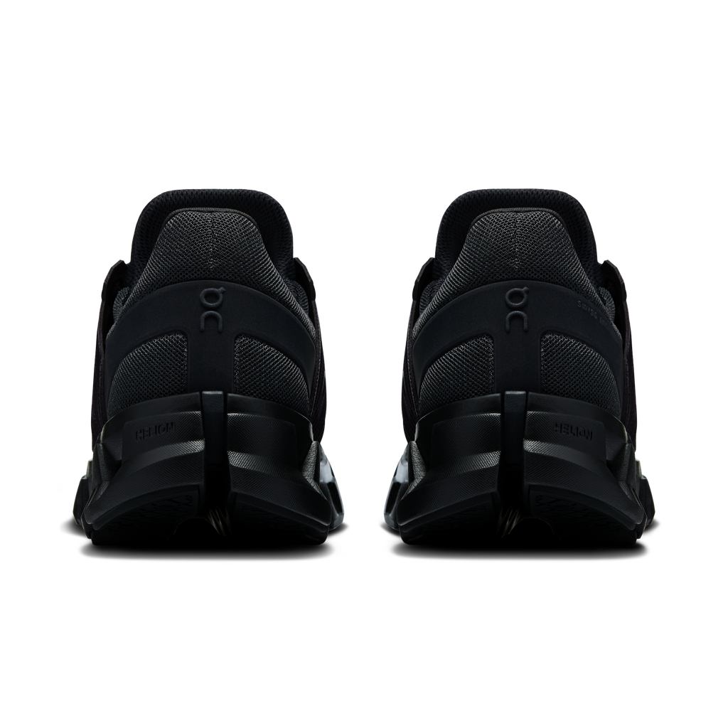 Women's black running shoes showing heel padding and rear On logo