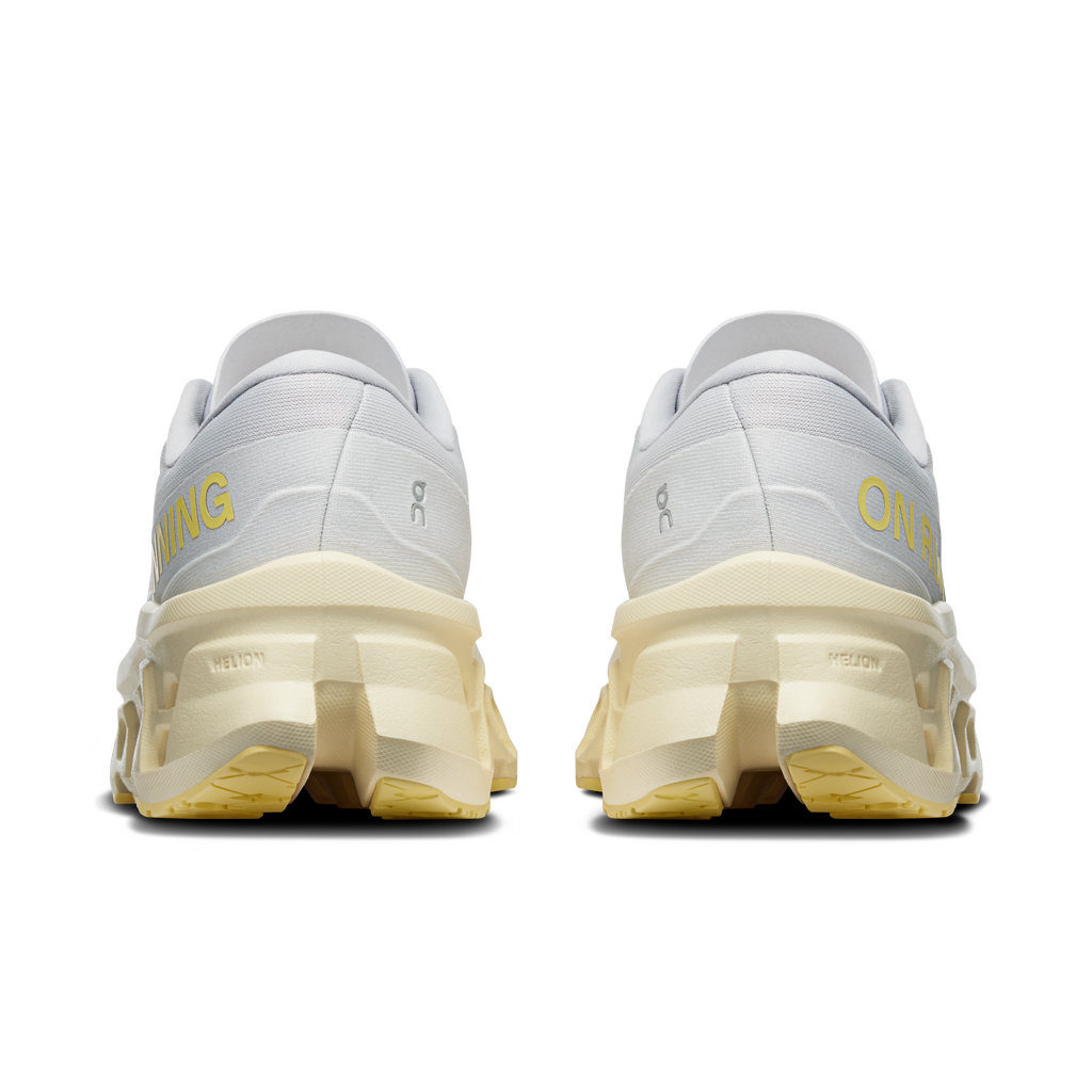 On Cloudmonster 3 heel view: light gray upper with yellow-tinted foam