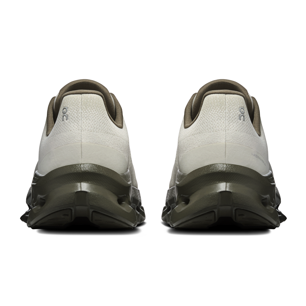 Men's running shoes heel view, off-white upper with dark gray/olive back and sole pods