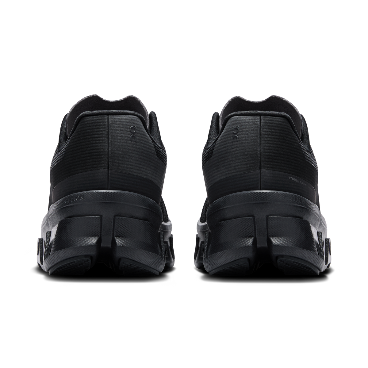 Women's black running shoes with cushioned heel and rear tread detail