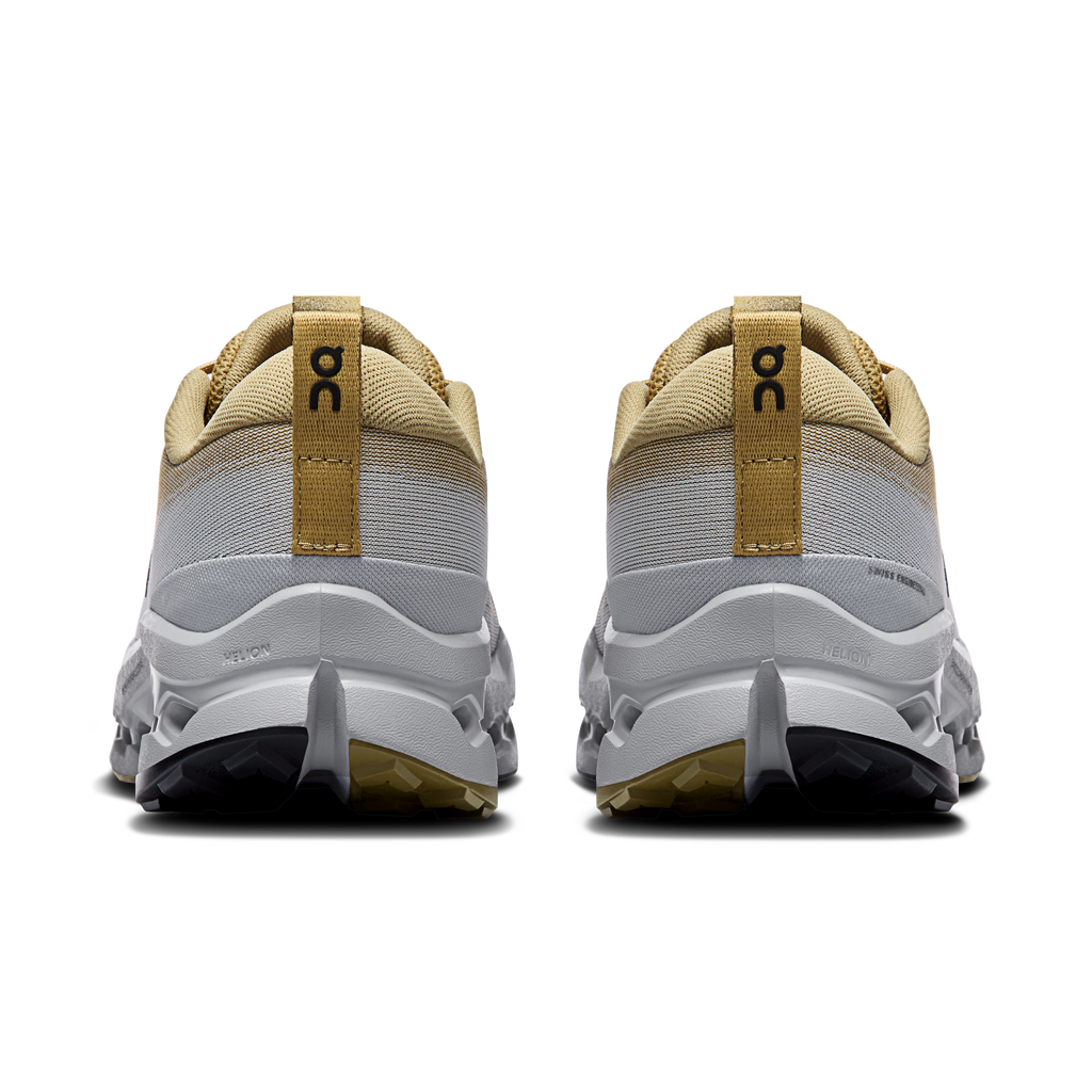 Men's trail running shoes, back view with tan heel loops and gray white midsole
