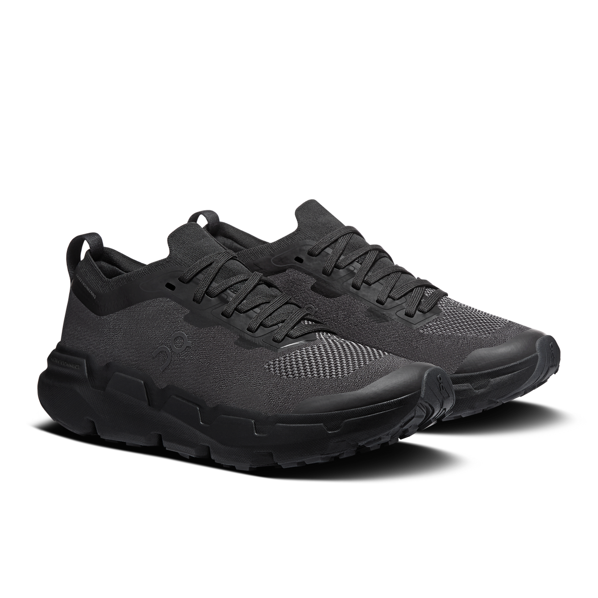 Women's black running shoes, angled side view with textured upper and laces