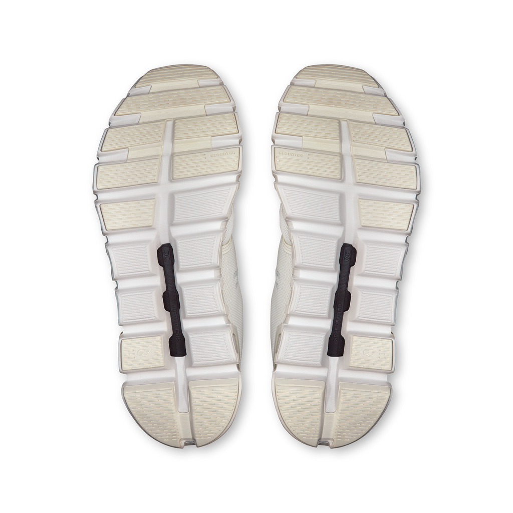 Pair of white On Cloud 6 women's shoe outsoles, tread pattern and cushioning pods