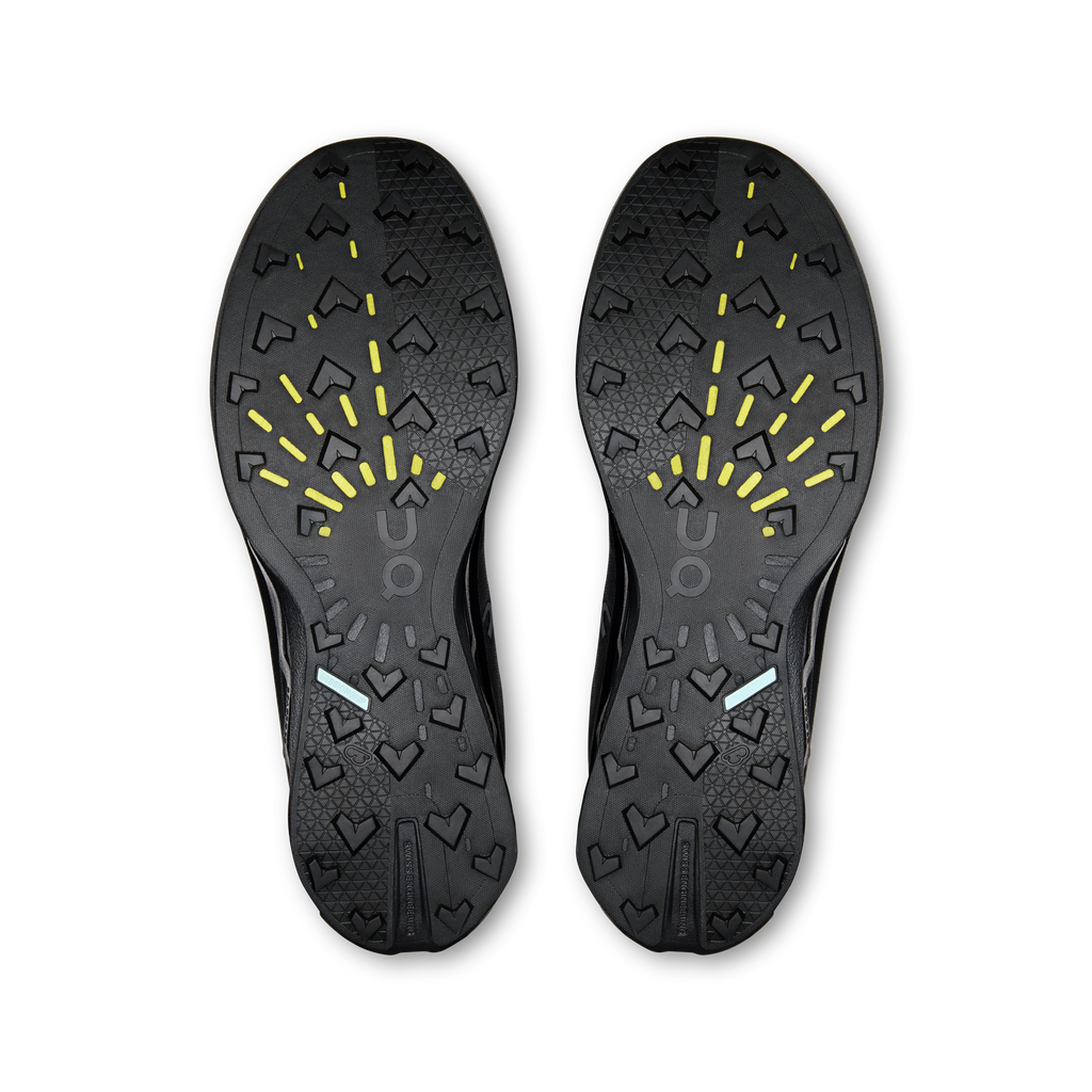 Pair of On shoe outsoles, dark tread pattern with yellow traction details