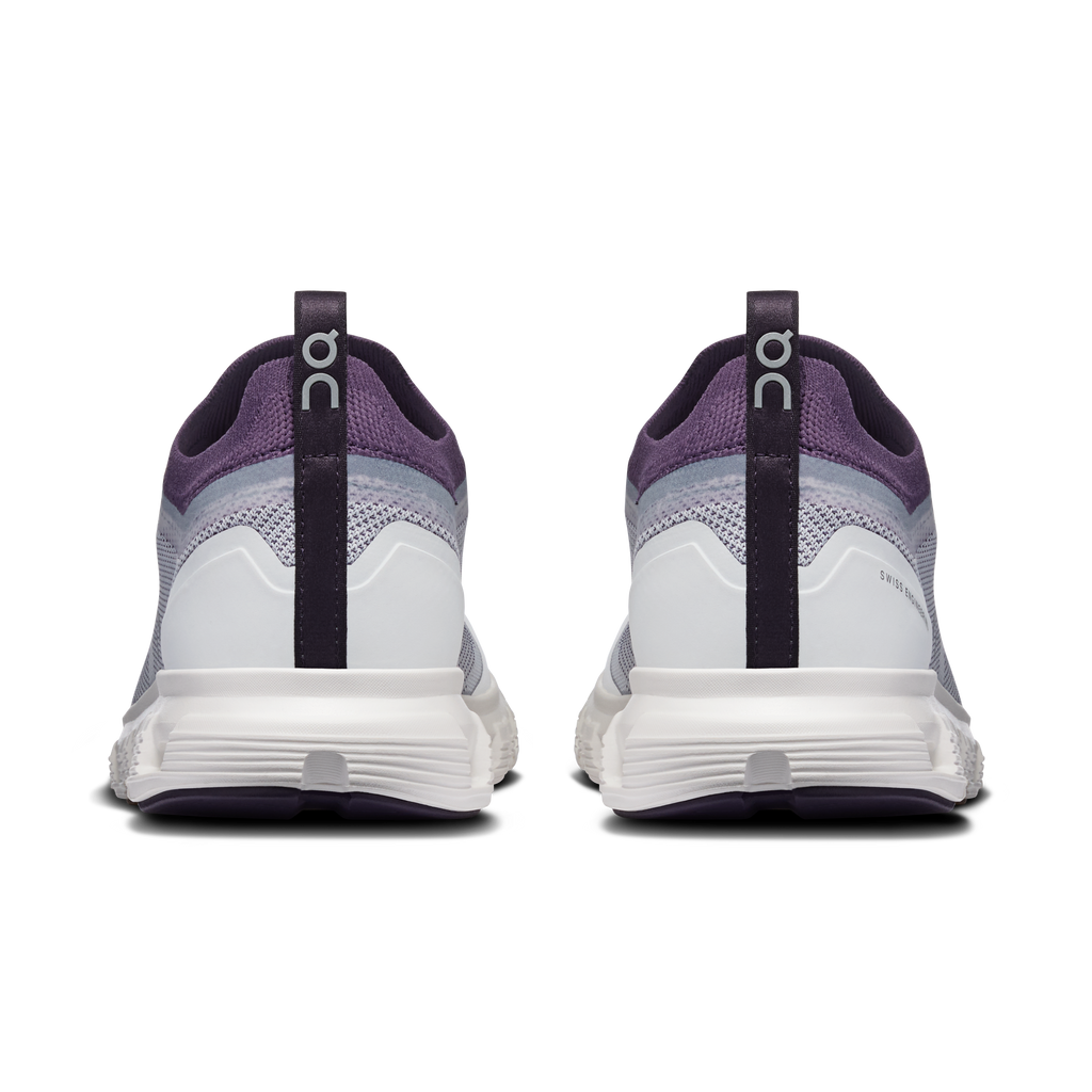 Back view of ivory and dark purple lace-up running shoes with heel pull tab