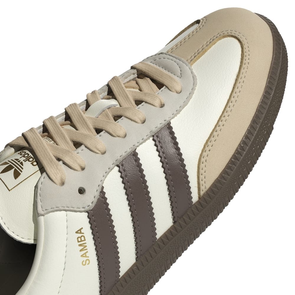 Adidas Samba OG sneakers, close-up of off-white upper, laces, and signature stripes