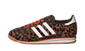 Leopard print low-top sneakers with three white adidas stripes, orange laces