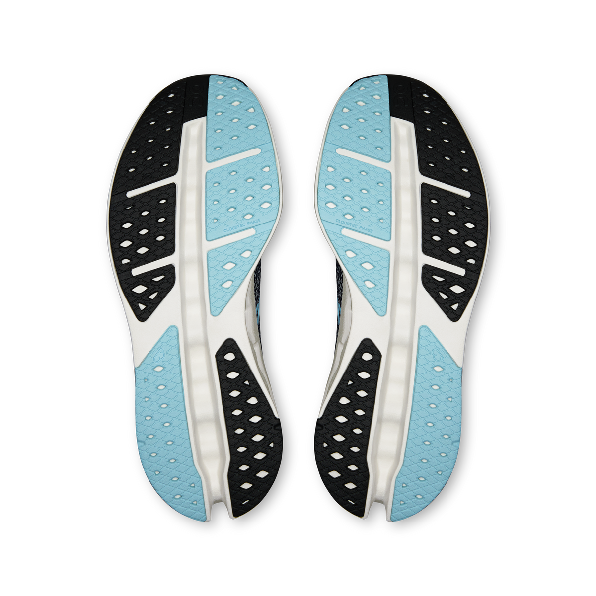 Pair of shoe outsoles with light blue inserts and black traction pods