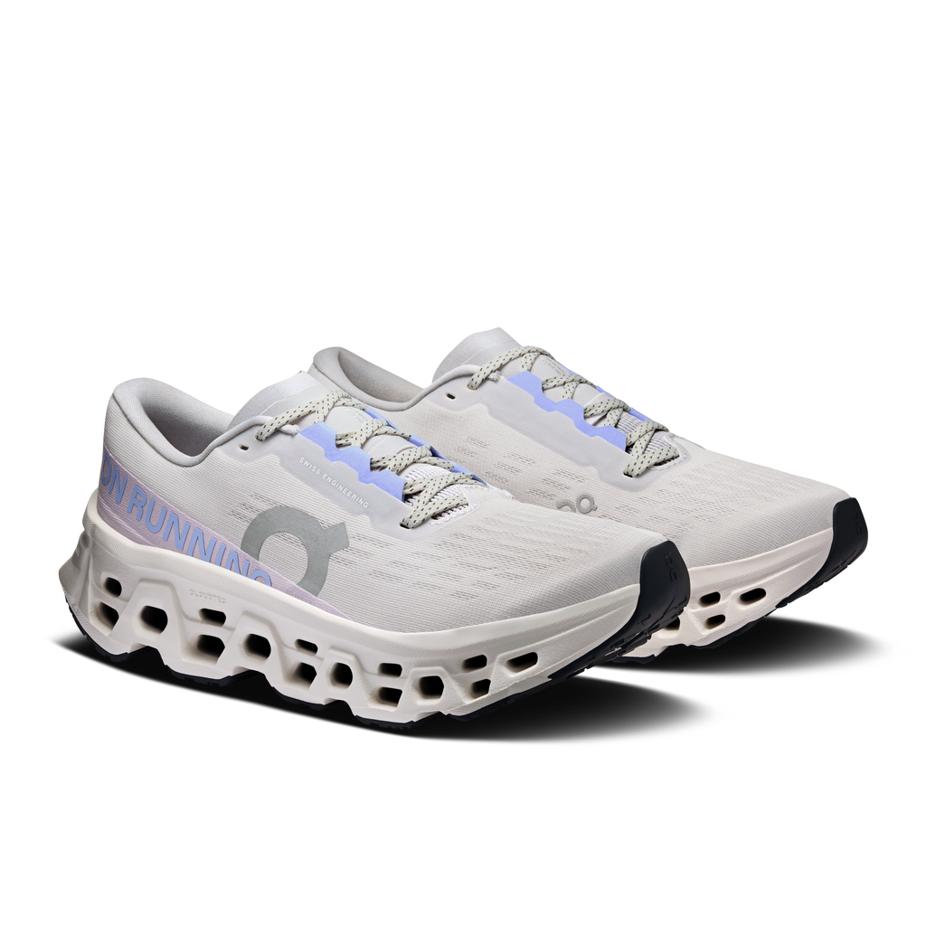 Women's wide running shoes, angled view with lace-up white upper and lavender details