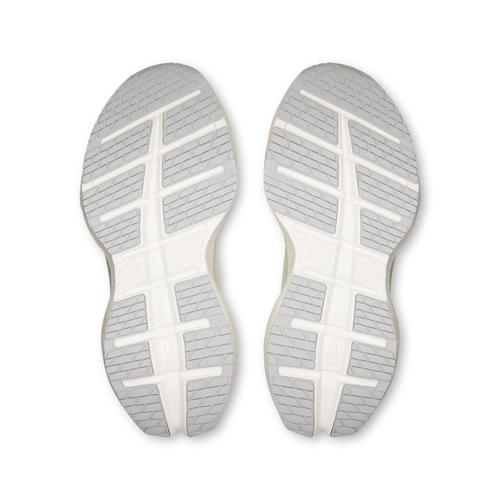 Pair of shoe outsoles with textured tread, white rubber soles