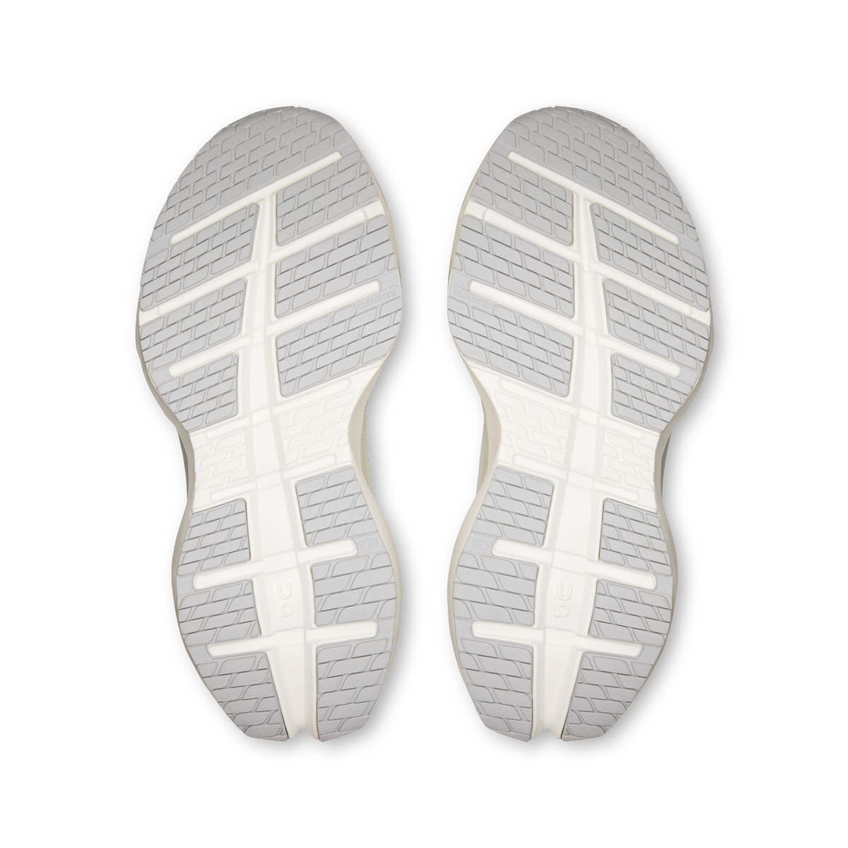 Pair of shoe outsoles with textured tread, white rubber soles