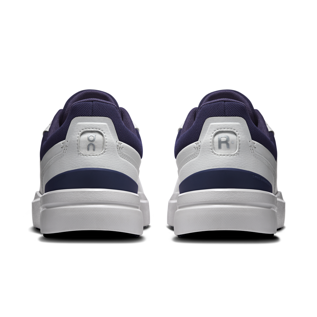 Back view of men's white sneakers with midnight blue heel collar and cushioned back tab