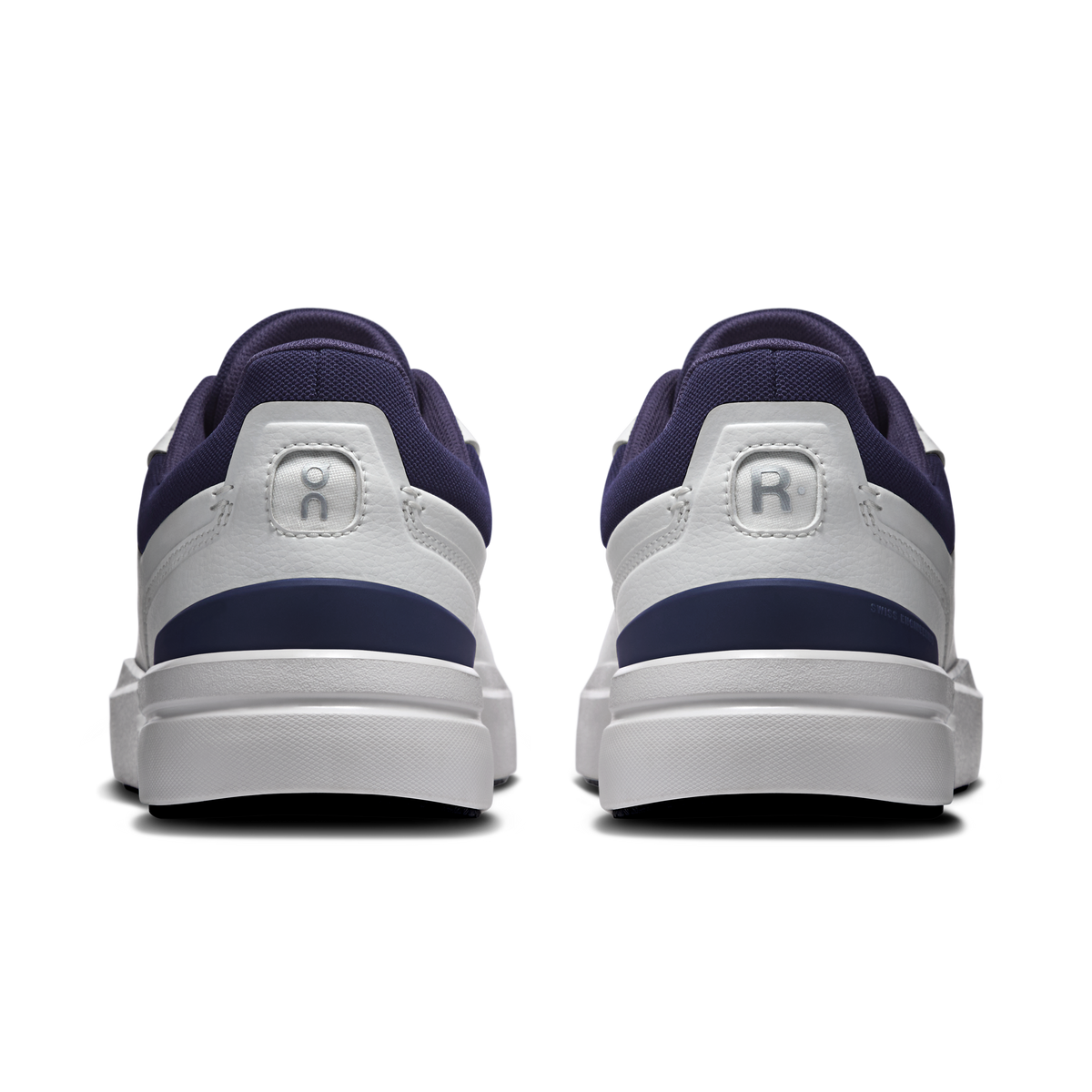 Back view of men's white sneakers with midnight blue heel collar and cushioned back tab