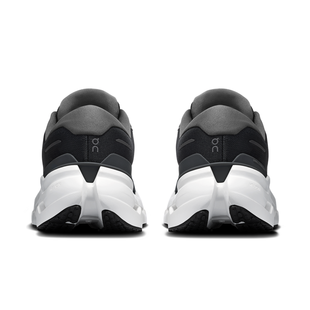 Black running shoes, rear view, with white midsole and gray heel tab accents.