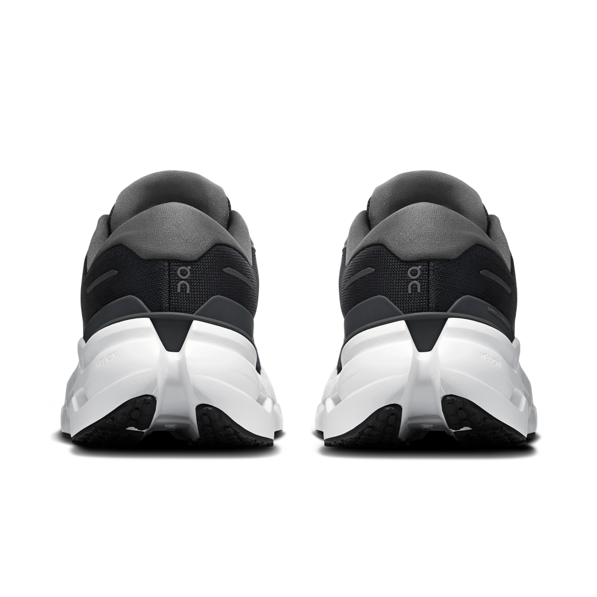Black running shoes, rear view, with white midsole and gray heel tab accents.