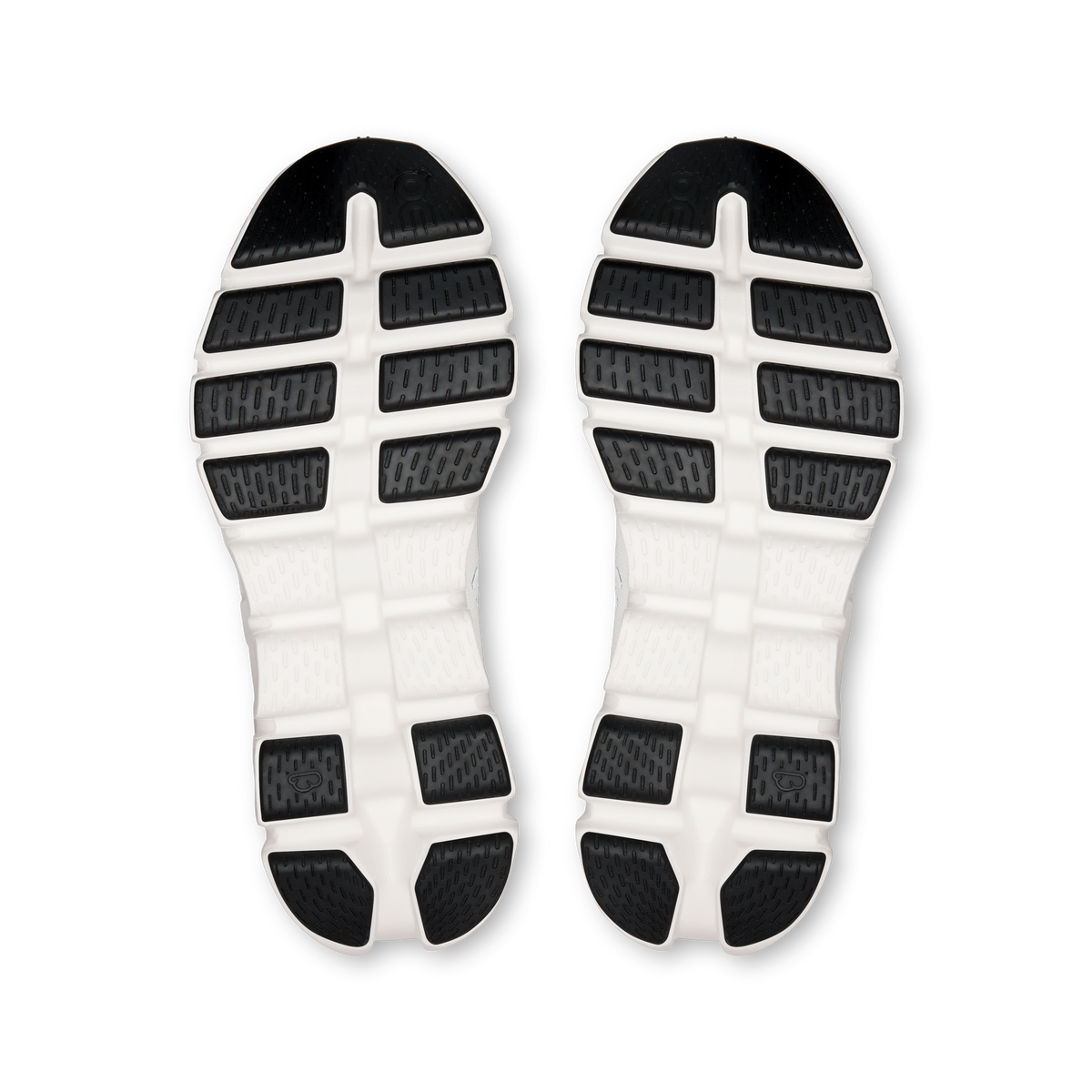 Women's shoe outsoles with white rubber tread and dark grip sections