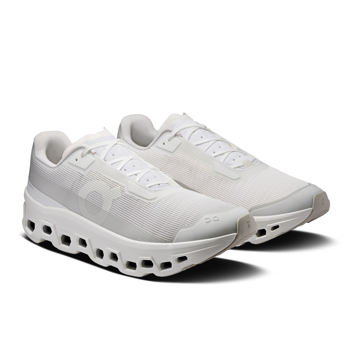 Men's white lace-up running shoes showing CloudTec pod outsole and textured upper