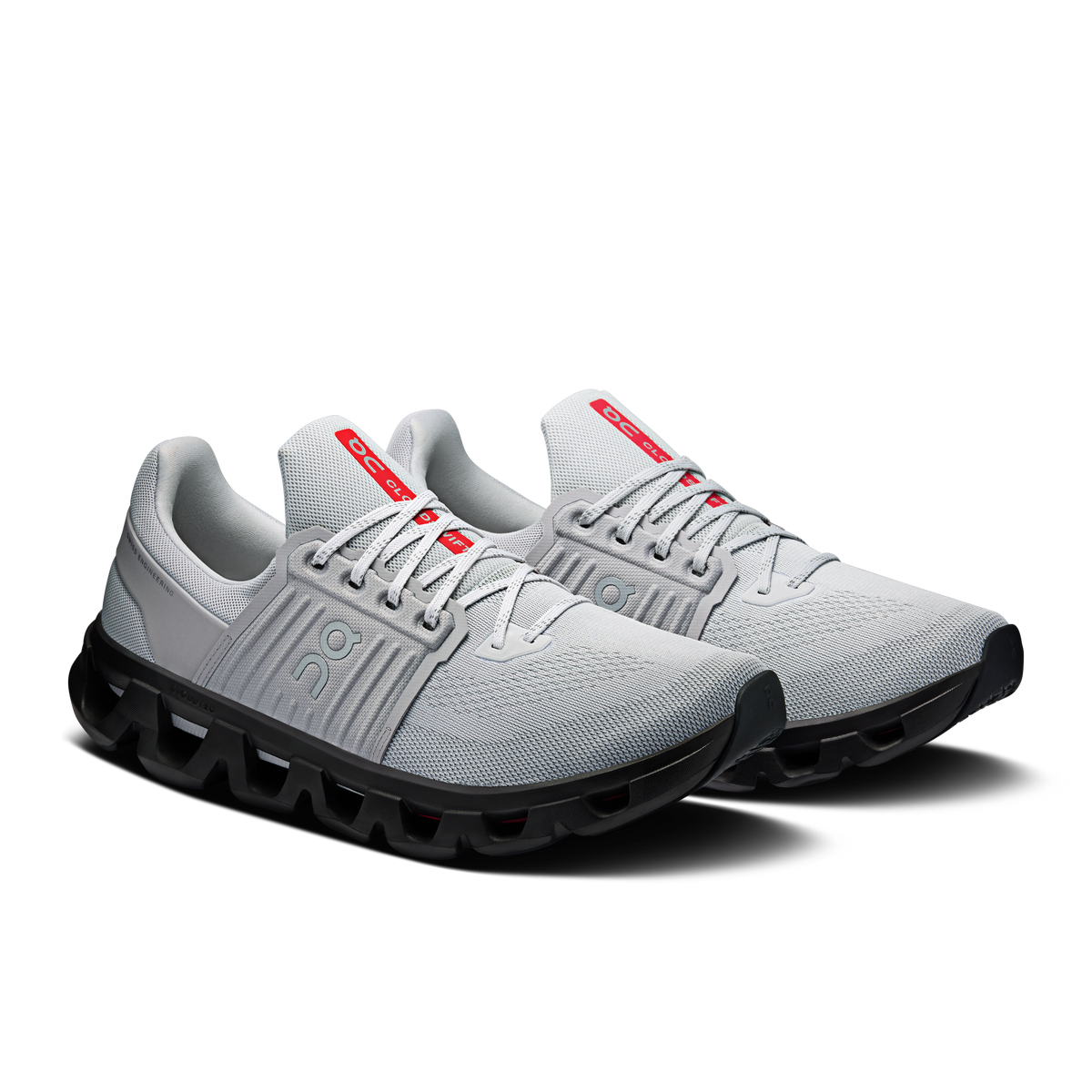 Men's running shoes, light gray upper, black sole, red heel tabs