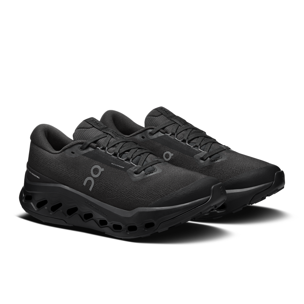 Black trail running sneakers with lace-up front, padded collar, and CloudTec sole