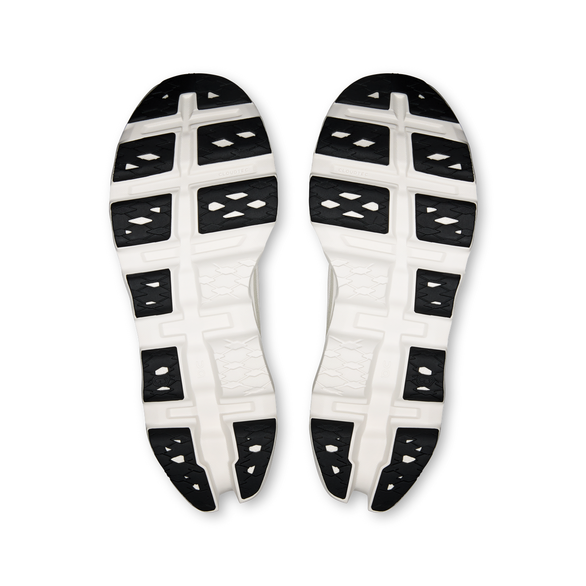 Ivory shoe outsole with tread pods and black grip sections