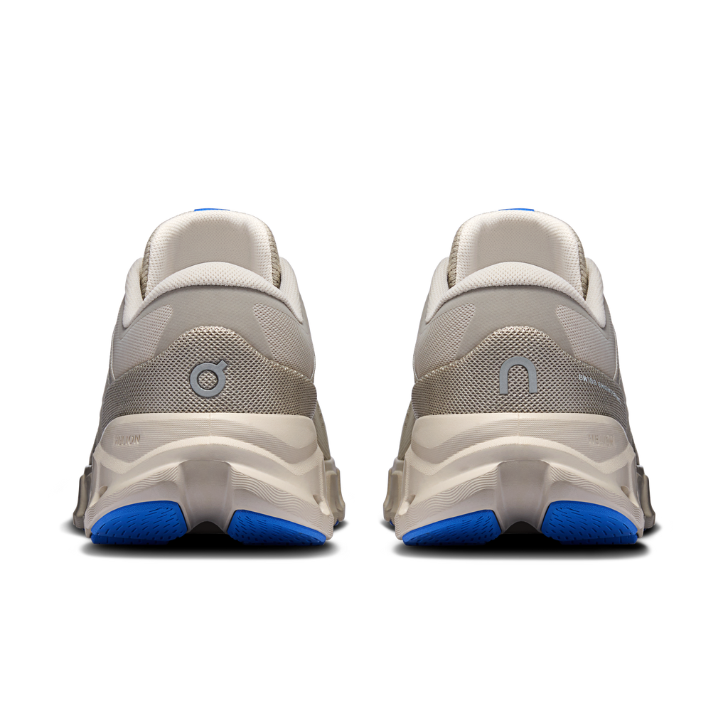Men's running shoes heel view in light gray with white and blue cushioned sole