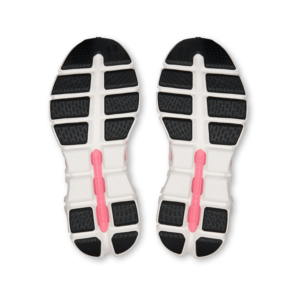 Pair of shoe outsoles with grippy tread and pink center support stripe
